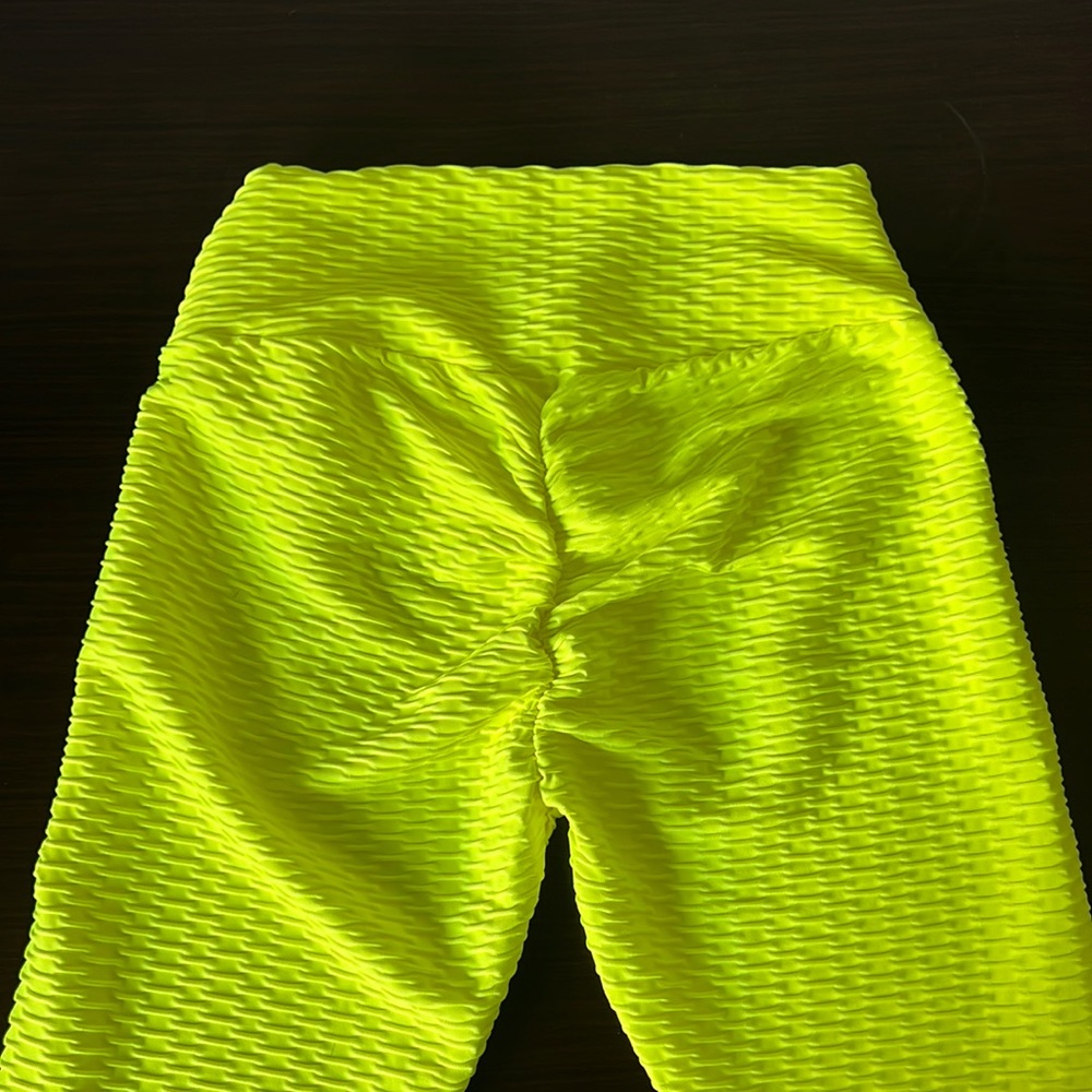 Brazilian scrunch butt leggings in neon yellow and various colors.